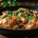 Moist and tender Mississippi Chicken in a cast iron skillet.