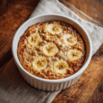 Wholesome Banana Bread Baked Oats in ceramic dish, close-up