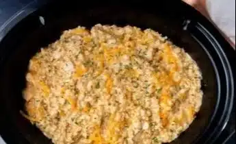 Crock Pot Chicken and Rice dish in a slow cooker ready to serve.
