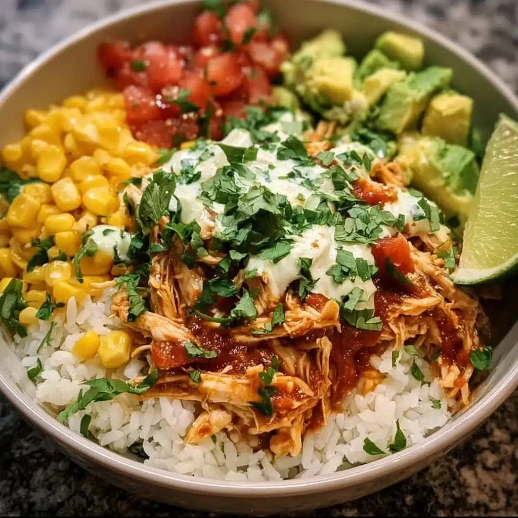 Delicious slow cooker chicken burrito bowl topped with fresh ingredients